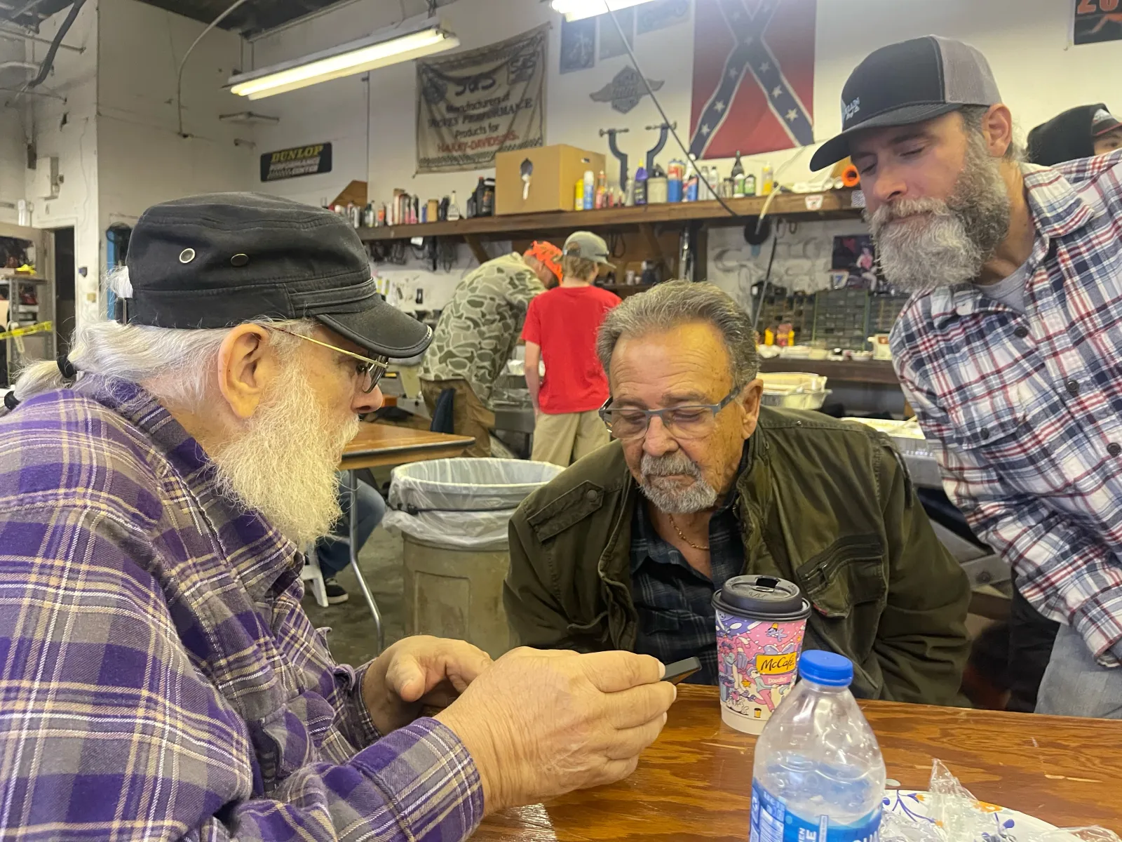 Greg in conversation with another rider at the workbench
